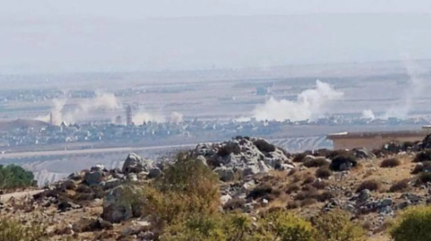 Smoke billows after an attack on the Idlib countryside in northwestern Syria. (Asharq Al-Awsat)