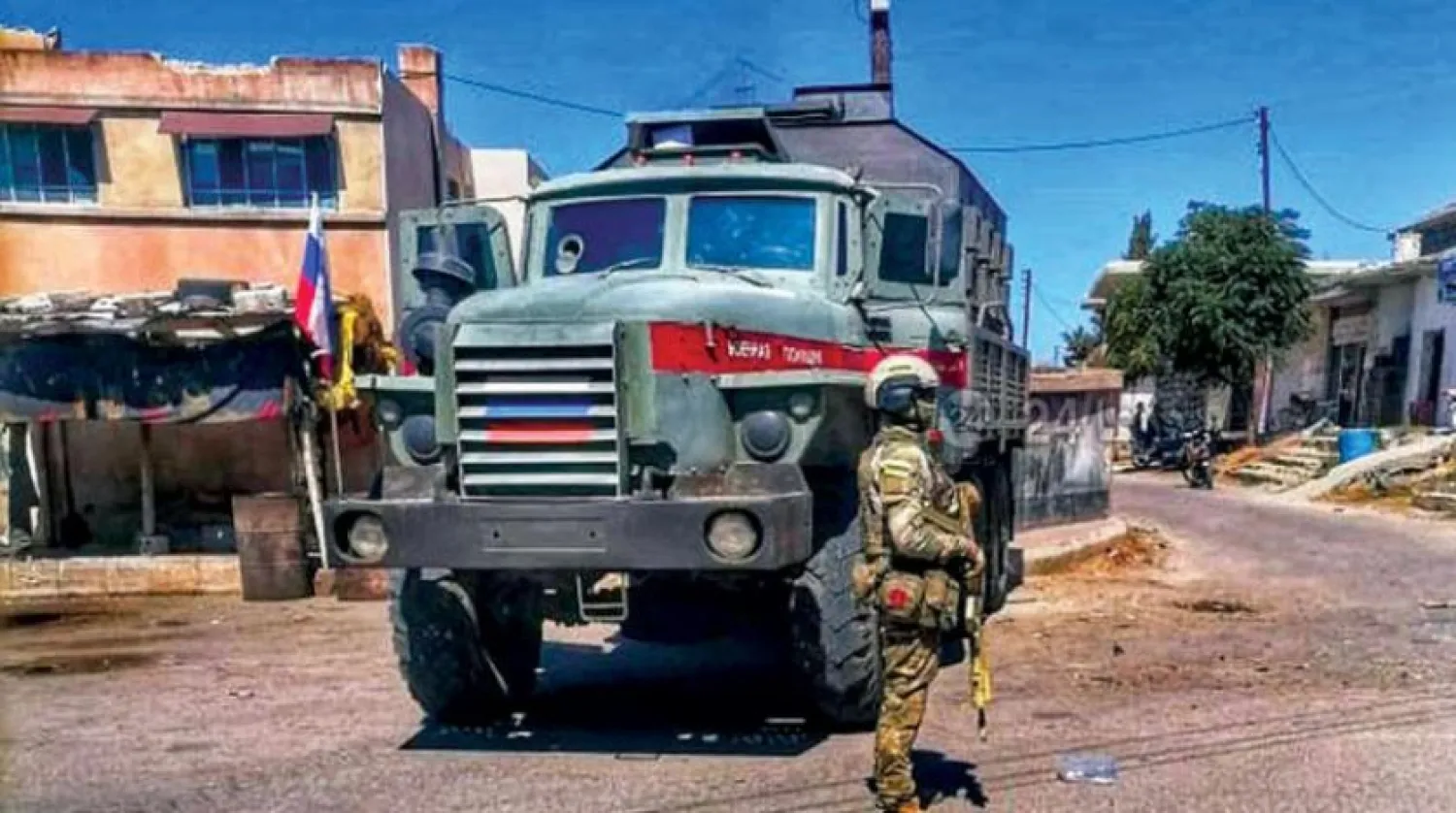 The Russian military police in front of the settlement center in the town of al-Shajarah in the Yarmouk basin. (Daraa 24)
