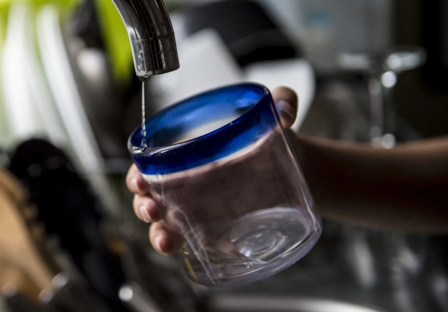 Water trickles out of a faucet. (Martin Bernetti/AFP via Getty Images)