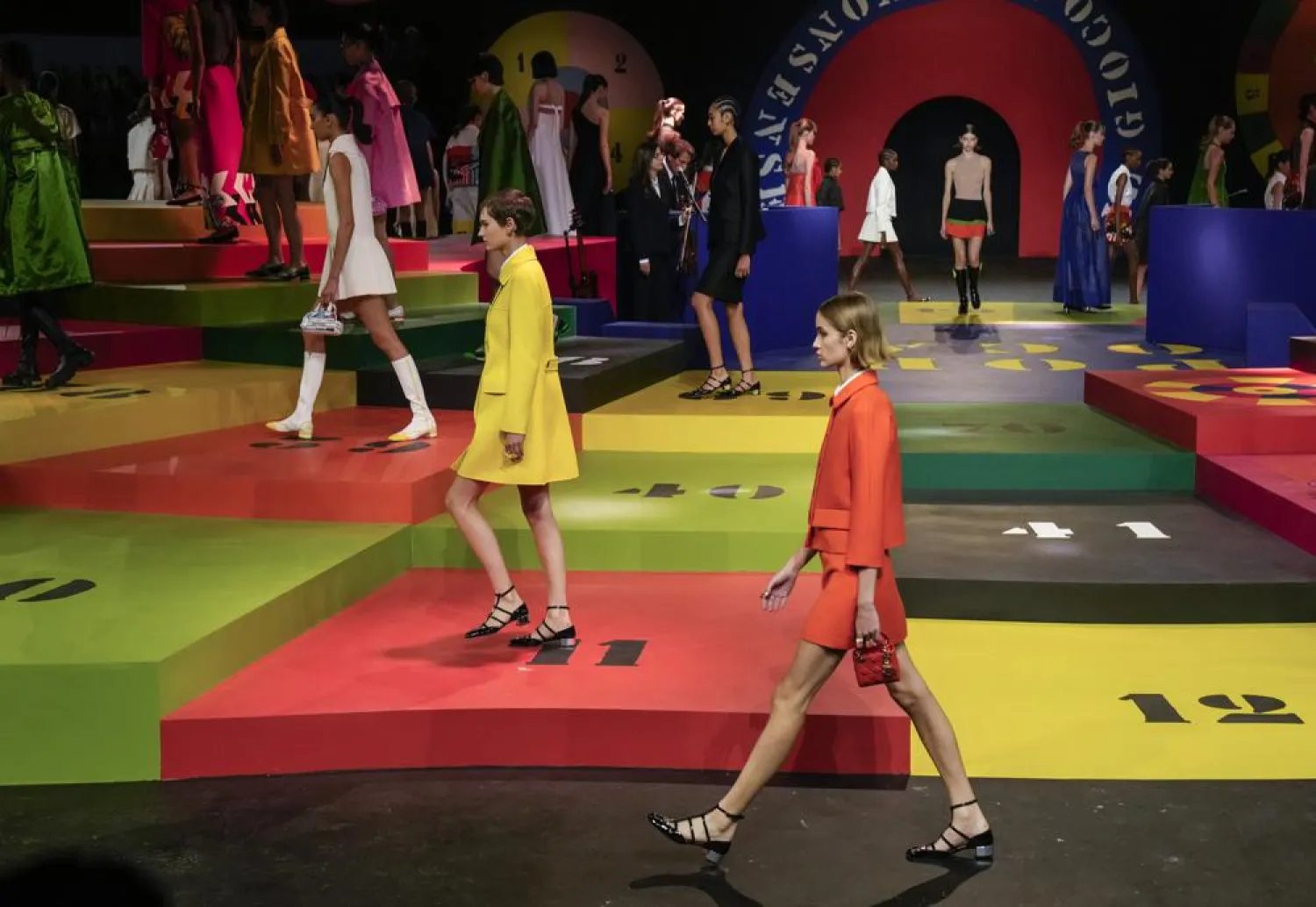 Models wear creations for the Dior Spring-Summer 2022 ready-to-wear fashion show presented Tuesday, Sept. 28, 2021, in Paris. (AP Photo/Francois Mori)

