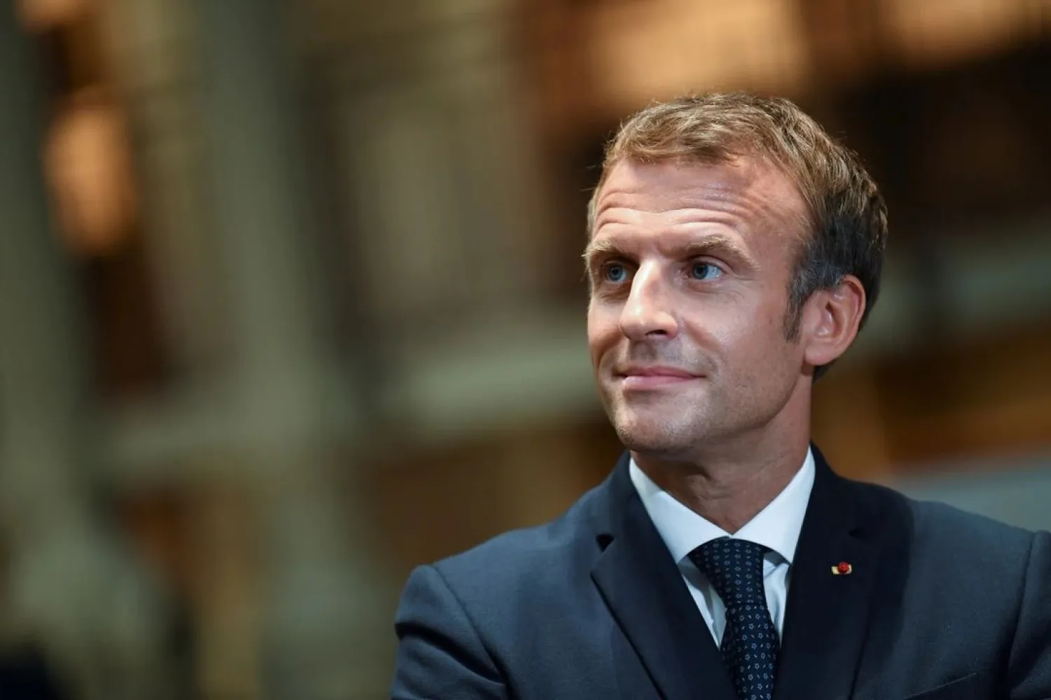 French President Emmanuel Macron looks on as he visits the Richelieu site of the Bibliotheque Nationale de France (National Library of France), after the completion of the renovation project and the 300th anniversary of the installation of the royal collections, in Paris, France, September 28, 2021. (Reuters)