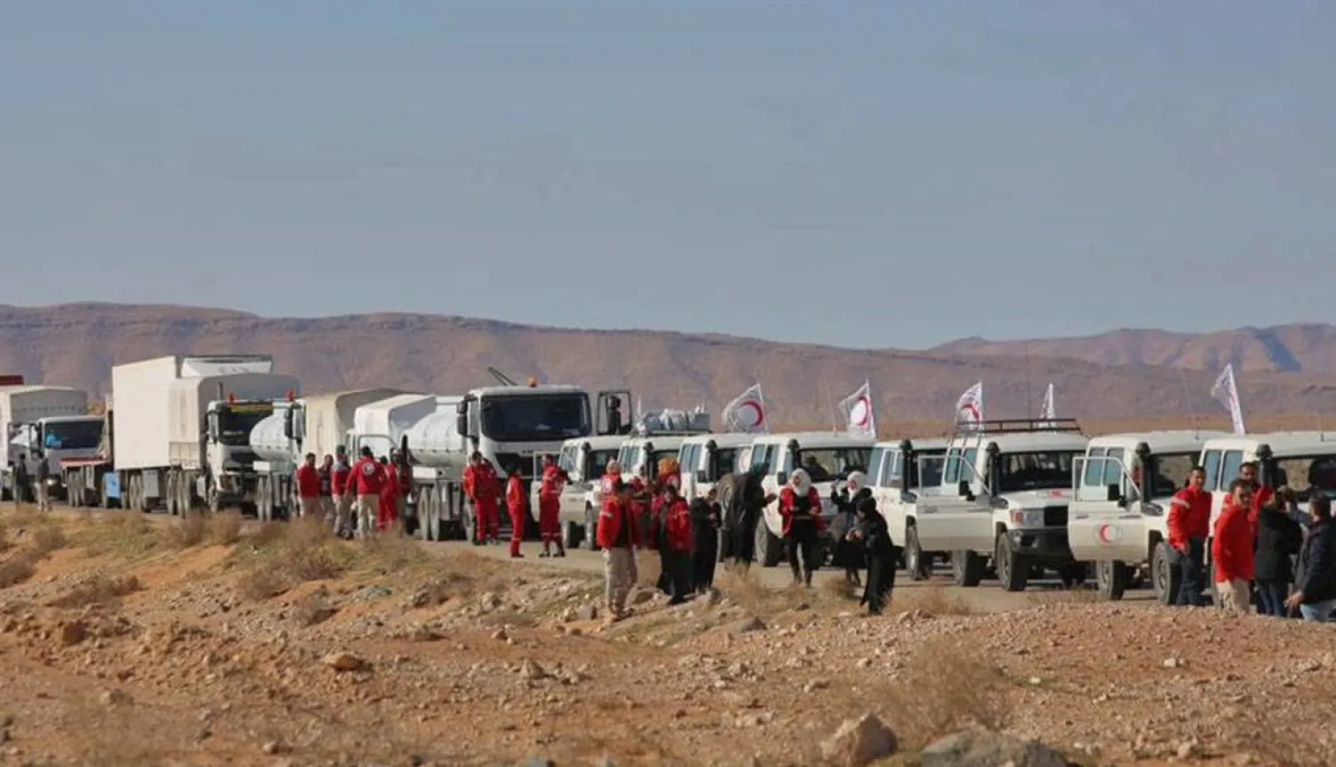 This Syrian Arab Red Crescent aid convoy in February 2019 is one of the very few to have reached the Rubkan camp near the Jordanian border - Syrian Red Crescent/AFP/File
