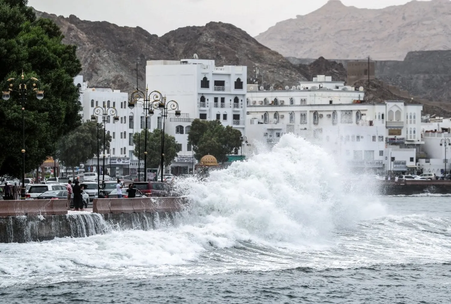 High waves break on the Mutrah sea side promenade in the Omani capital Muscat on October 2, 2021, as the Shaheen tropical storm hits the country. (Photo by Haitham AL-SHUKAIRI / AFP)