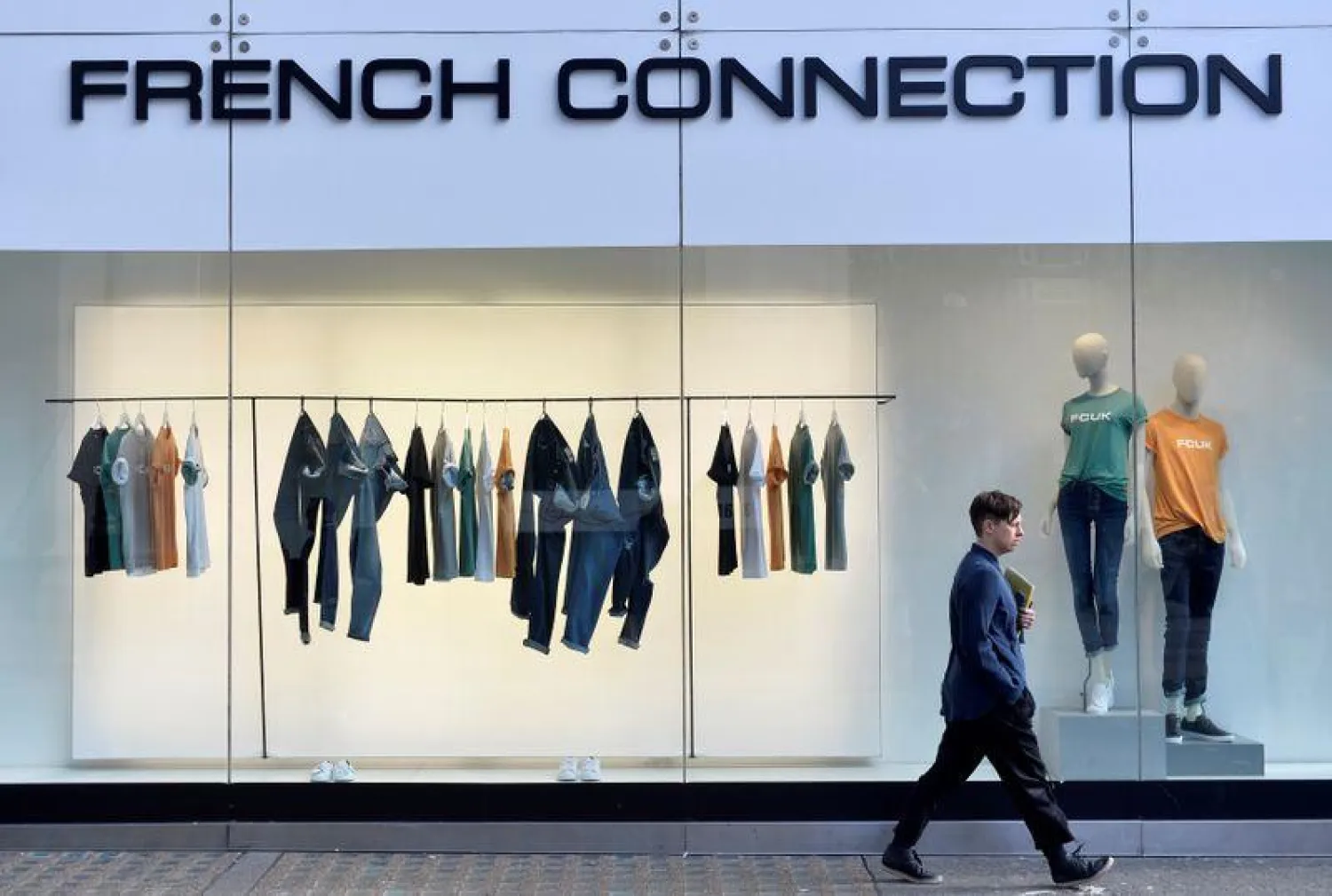 A person walks past a French Connection store in London, Britain, 14 March, 2016. (Reuters)