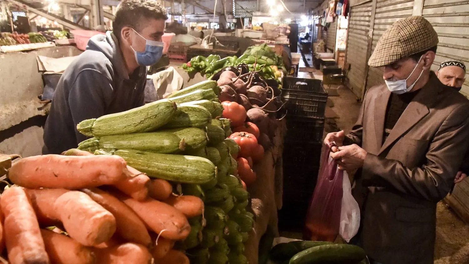 Consumers at Ali Mellah produce market in Algeria's capital Algiers. (AFP)