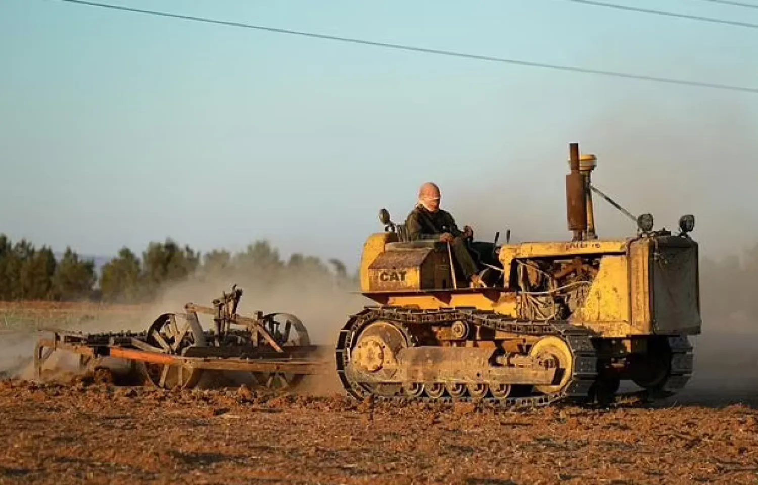 A farmer ploughs a wheat field in the northeastern Kurdish-held city of Qamishli, part of the Syria's breadbasket region of Hasakah which has been hit hard by low rainfall - AFP