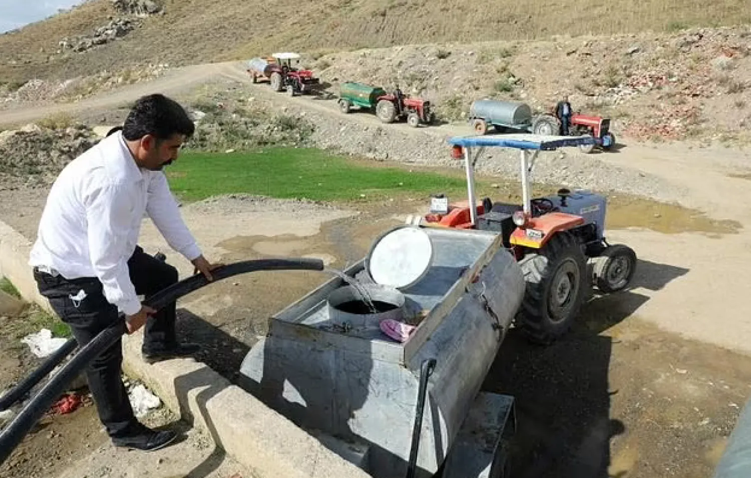 Severe droughts in Turkey have forced farmers to fill tanks with water - AFP