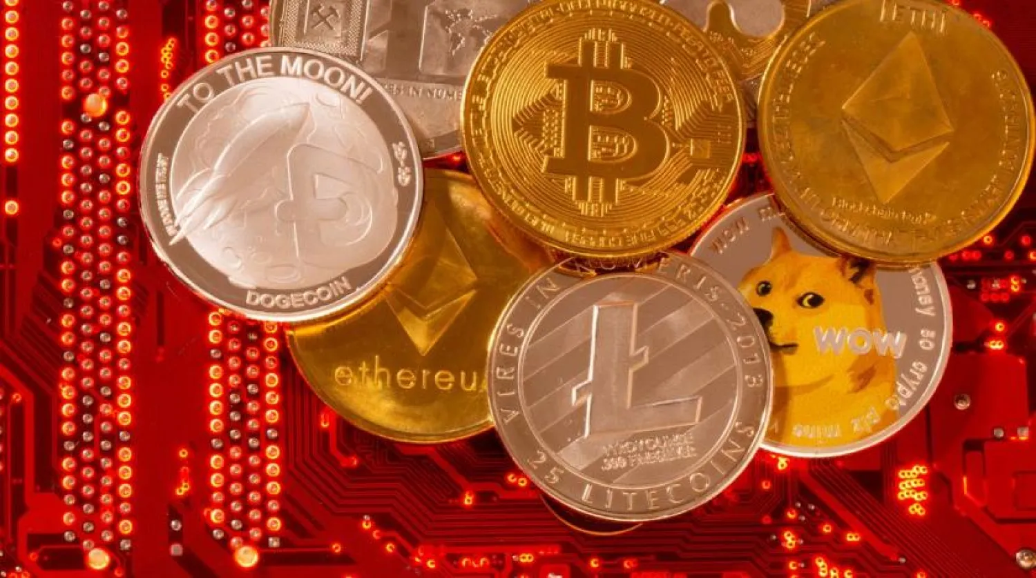 Representations of cryptocurrencies Bitcoin, Ethereum, DogeCoin, Ripple, Litecoin are placed on PC motherboard in this illustration taken, June 29, 2021. Reuters
