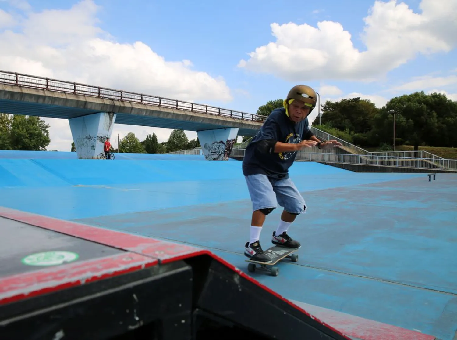 Yoshio Kinoshita practices skateboarding at a park in Daito, Osaka Prefecture, October 6, 2021. (Reuters)