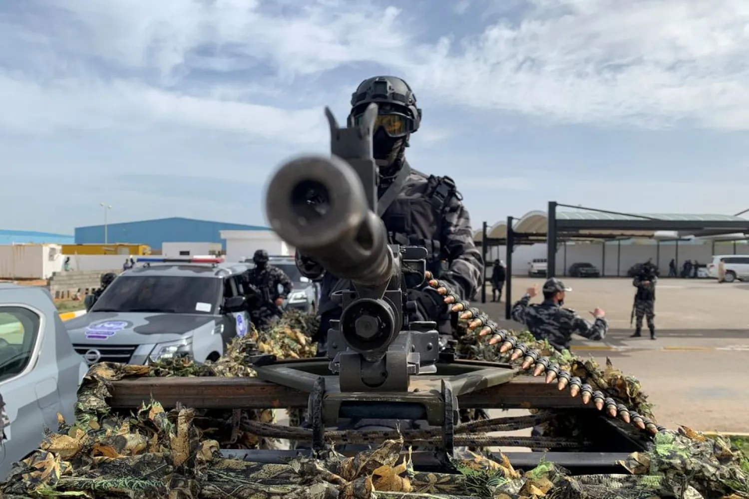 A member of security forces stands behind a weapon, in Tripoli, Libya February 1, 2021. (Reuters)