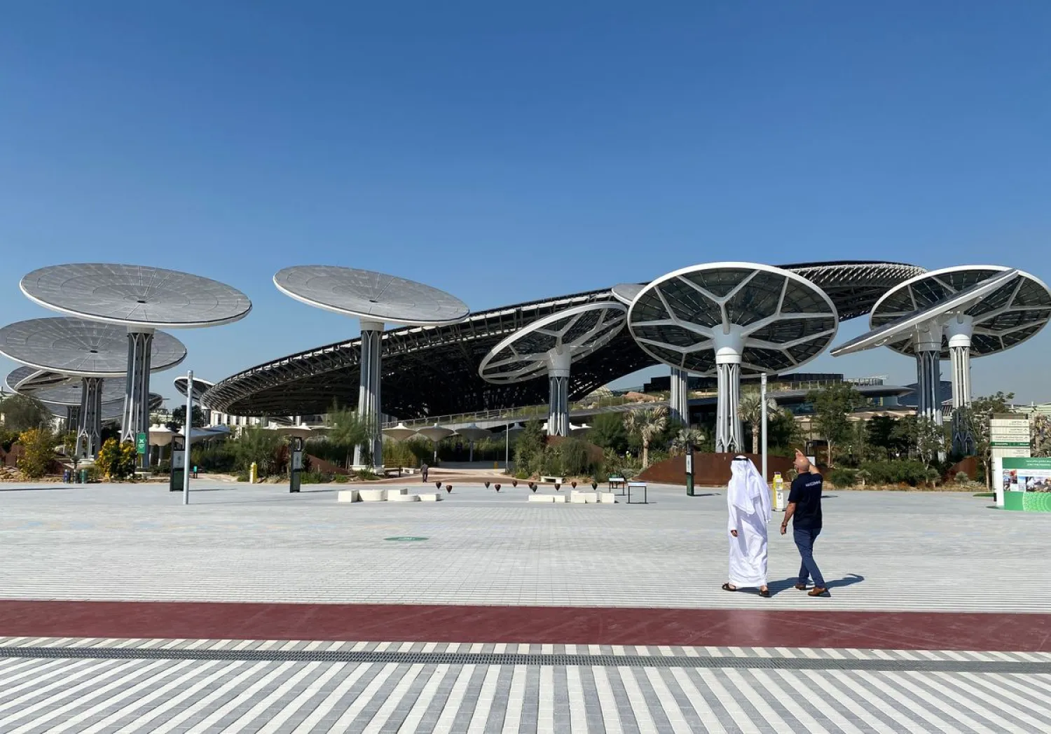 People walk at the site of Dubai Expo 2020 in Dubai, United Arab Emirates January 16, 2021. REUTERS/Rula Rouhana
