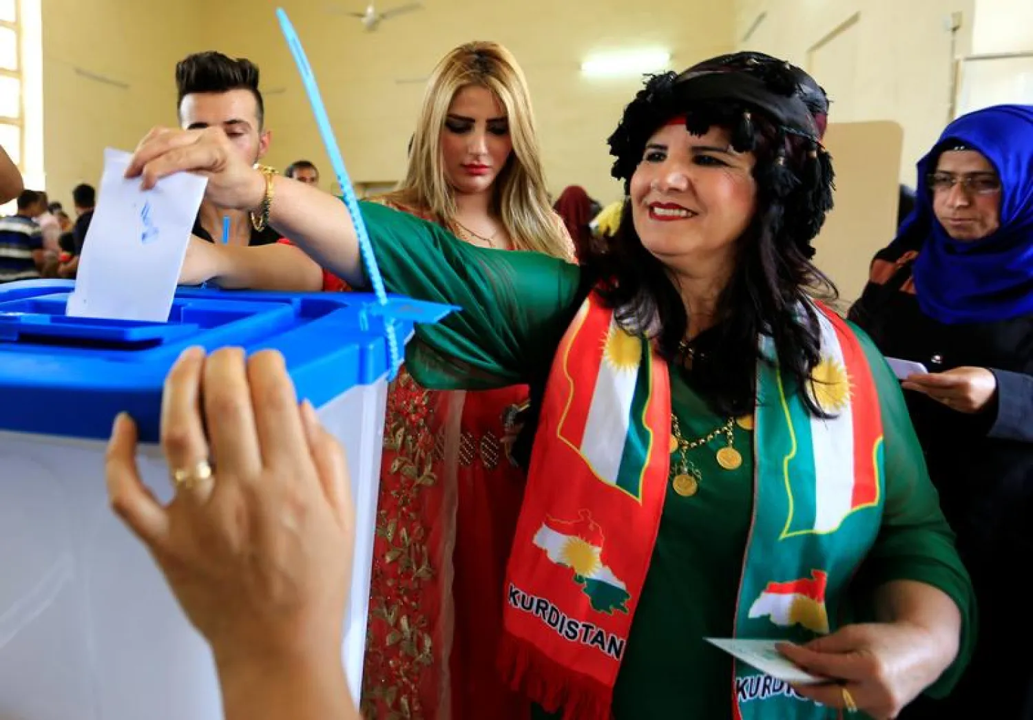 A woman casts her vote at a polling station in Kirkuk (Reuters)
