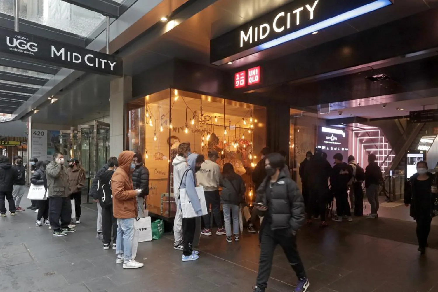 Customers line up to enter a store in the central business district after more than 100 days of lockdown to help contain the COVID-19 outbreak in Sydney, Monday, Oct. 11, 2021. (AP)