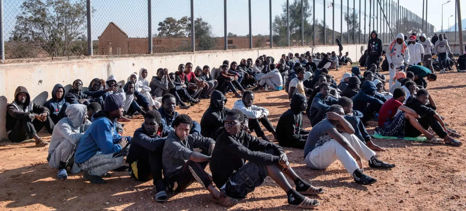 UNICEF/Alessio Romenzi. Migrants sit in the courtyard of a detention center in Libya. (file)