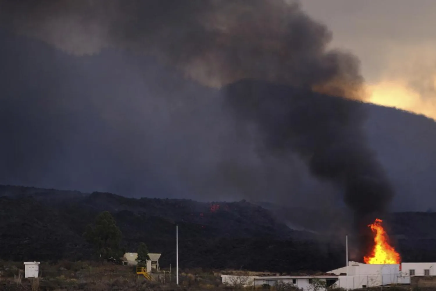A house is burnt by the lava on the Canary island of La Palma, Spain, on Wednesday, Oct. 13, 2021.(AP Photo/Daniel Roca)
