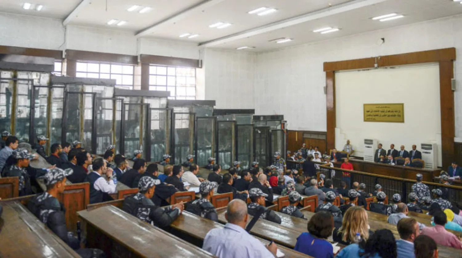 محاكمة قيادات الإخوان في المحكمة الجنائية بالقاهرة يوليو 2018 (أ.ف.ب)