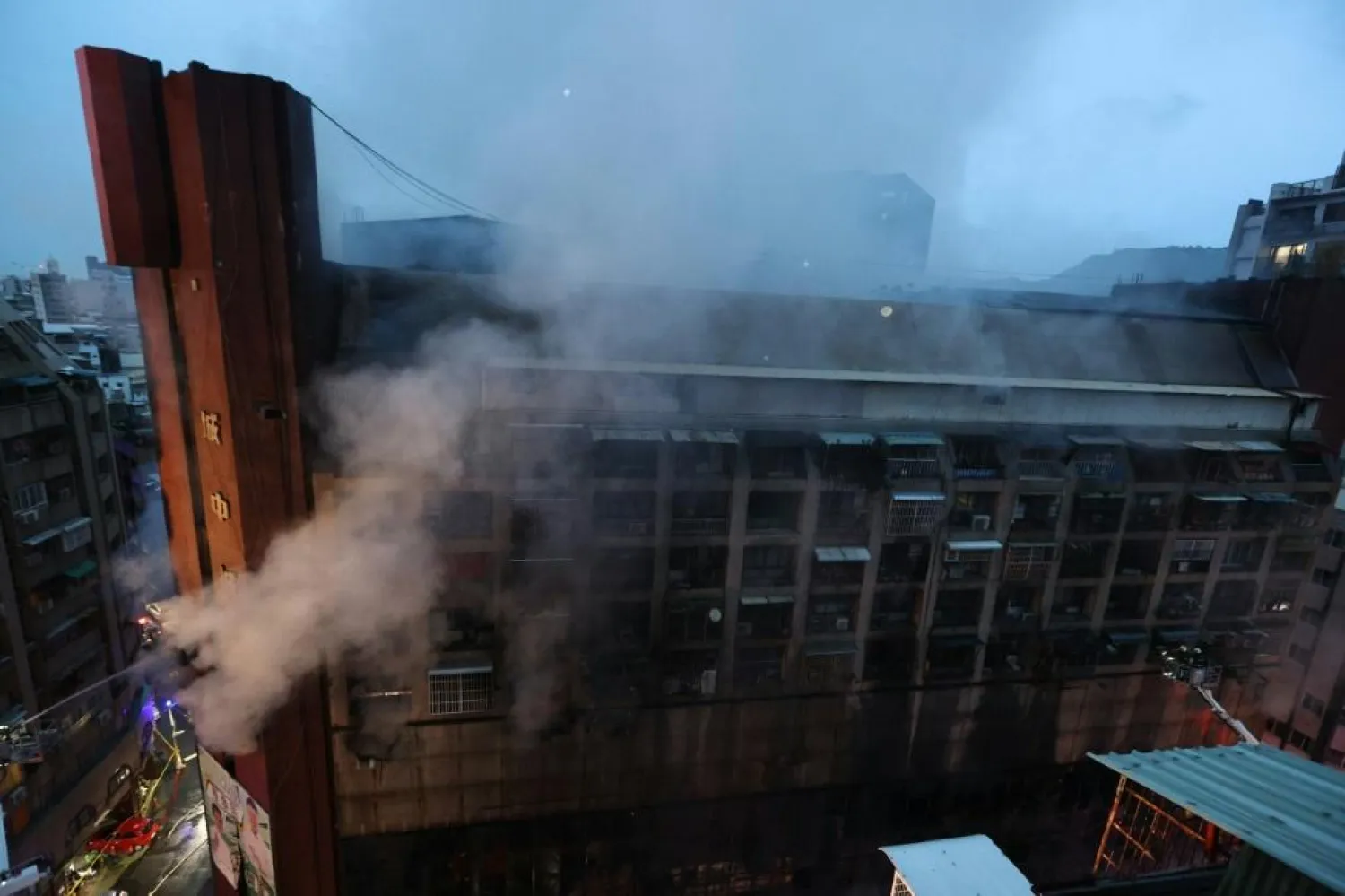 The blaze broke out in the 13-storey, mixed-use building in the small hours of Thursday morning. Photo: AFP / Johnson Liu