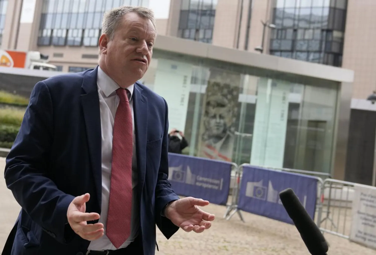 United Kingdom's Brexit negotiator Lord David Frost speaks with the media as he arrives for a lunch with European Commissioner for Inter-institutional Relations and Foresight Maros Sefcovic at EU headquarters in Brussels, Friday, Oct. 15, 2021.  (AP Photo/Virginia Mayo)
