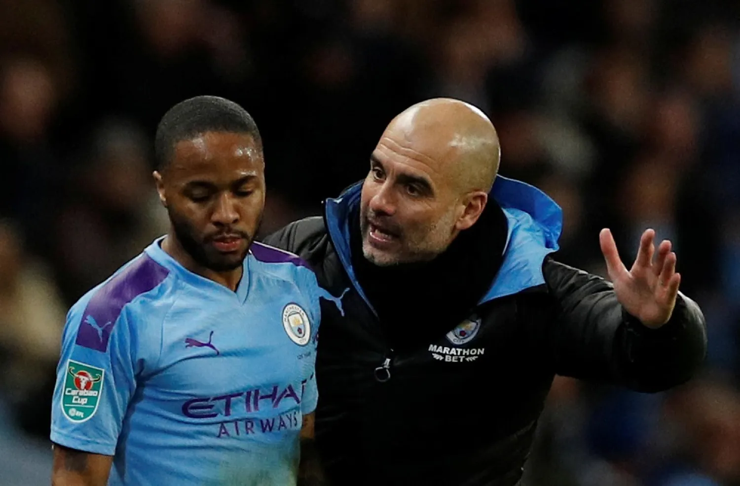 Manchester City manager Pep Guardiola with Raheem Sterling. (Reuters)