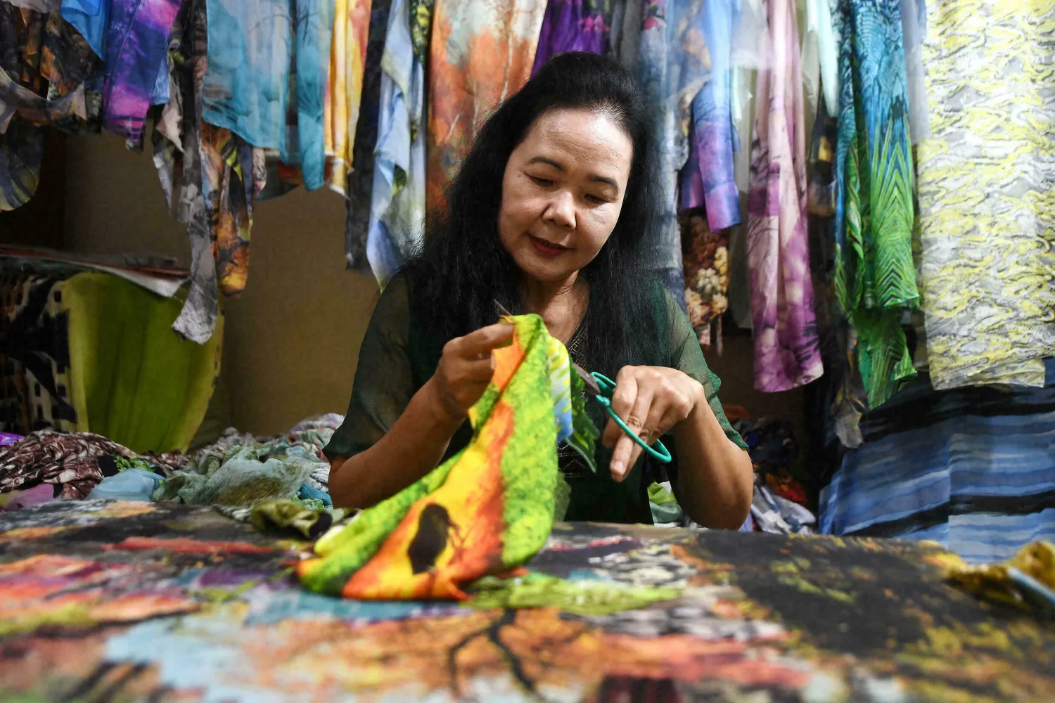 For most of the years Thuc has worked with cloth, she has also kept a day job as a civil servant. Nhac NGUYEN AFP
