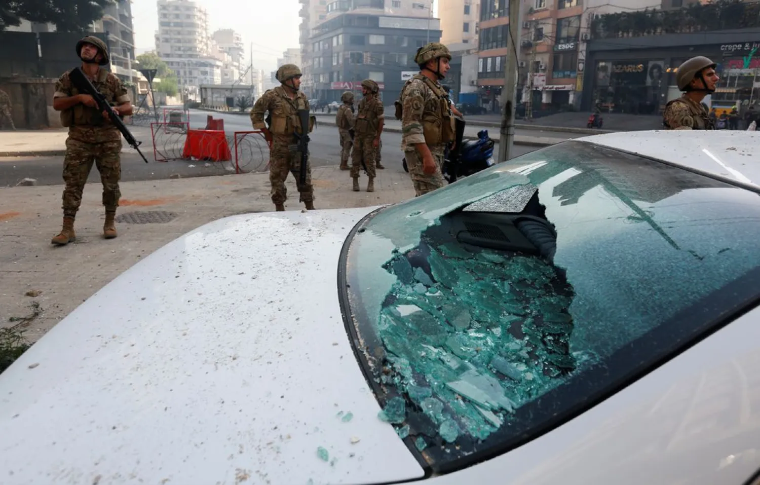 A damaged vehicle is pictured as soldiers are deployed after gunfire erupted in Beirut, Lebanon October 14, 2021. (Reuters)