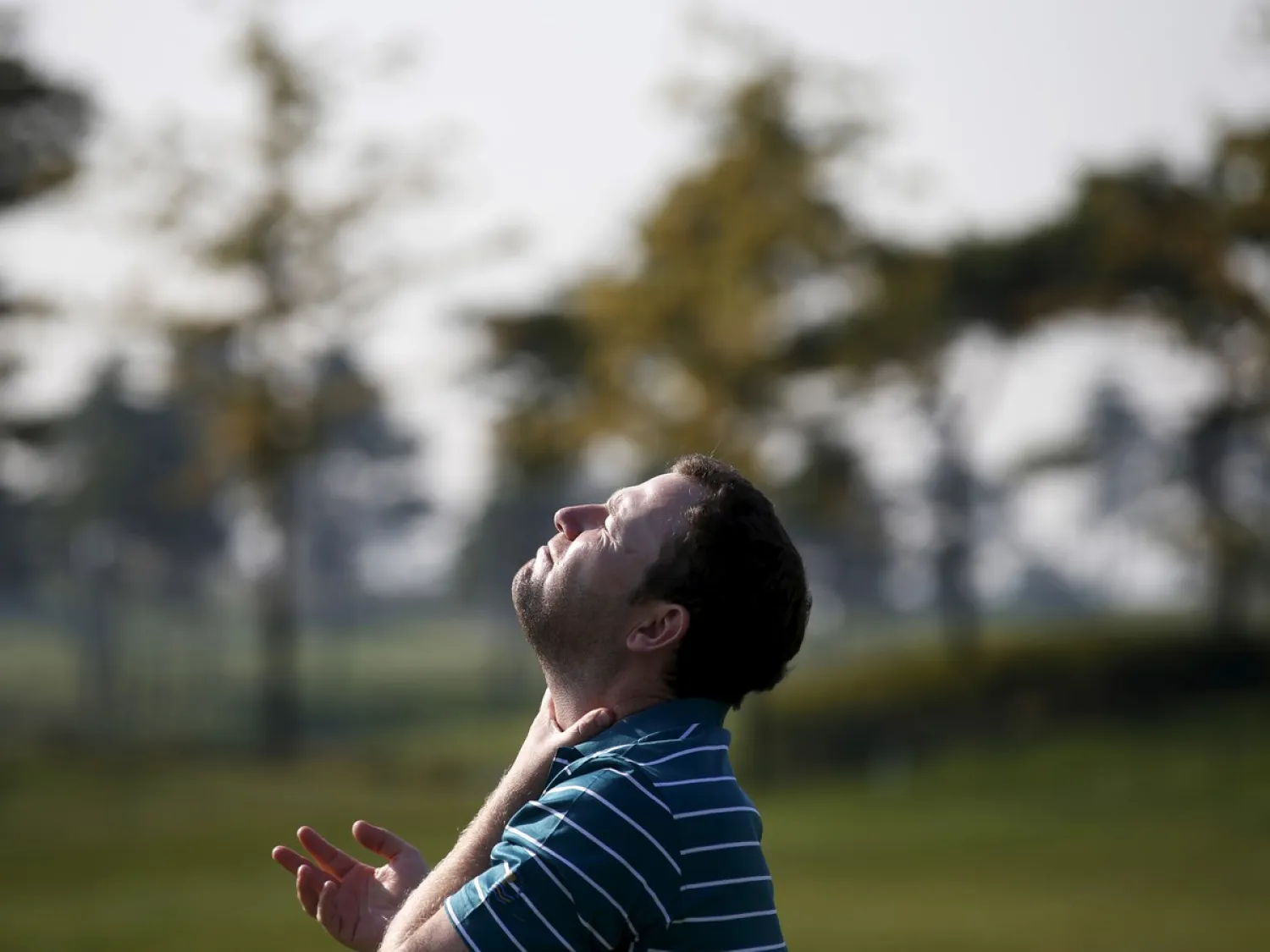 A man looks at the sun. Kim Hong-Ji / Reuters