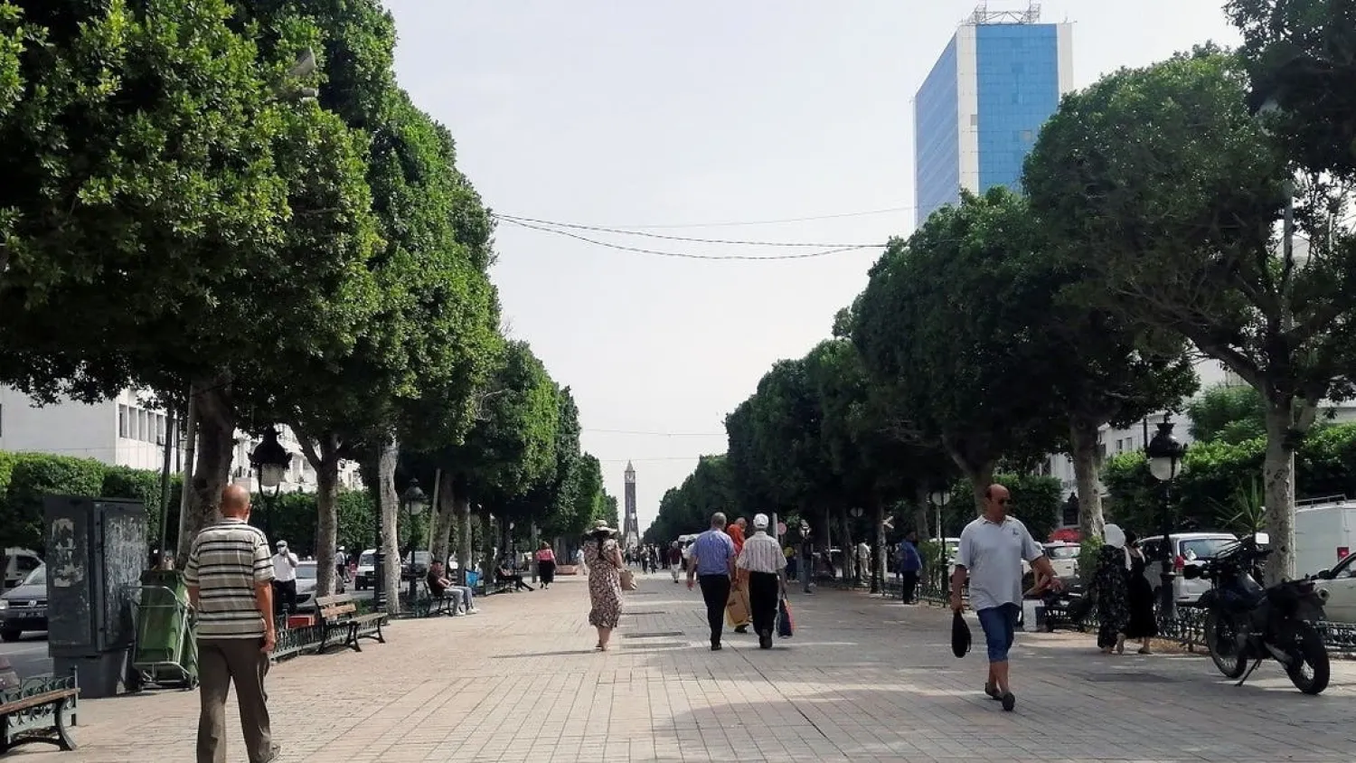 People walk along a street in Tunis, Tunisia, on September 23, 2021. (Reuters)
