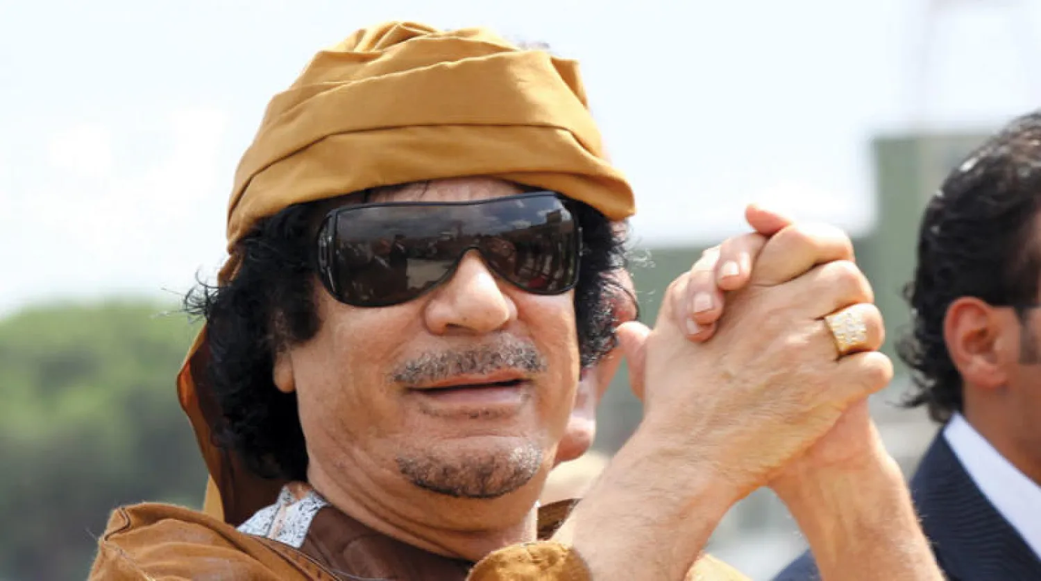 الرئيس الليبي الراحل معمر القذافي (غيتي)
