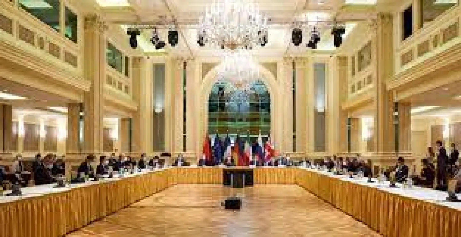 European External Action Service (EEAS) Deputy Secretary General Enrique Mora and Iranian Deputy at Ministry of Foreign Affairs Abbas Araghchi wait for the start of a meeting of the JCPOA Joint Commission in Vienna, Austria April 6, 2021. EU Delegation in Vienna/Handout via REUTERS