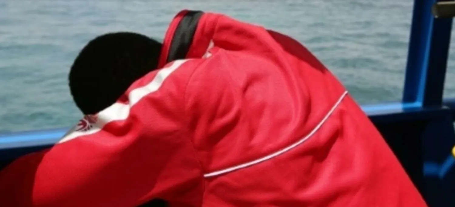 A migrant on a boat off the coast of Zarzis, Tunisia, on August 1, 2018.  AFP file photo