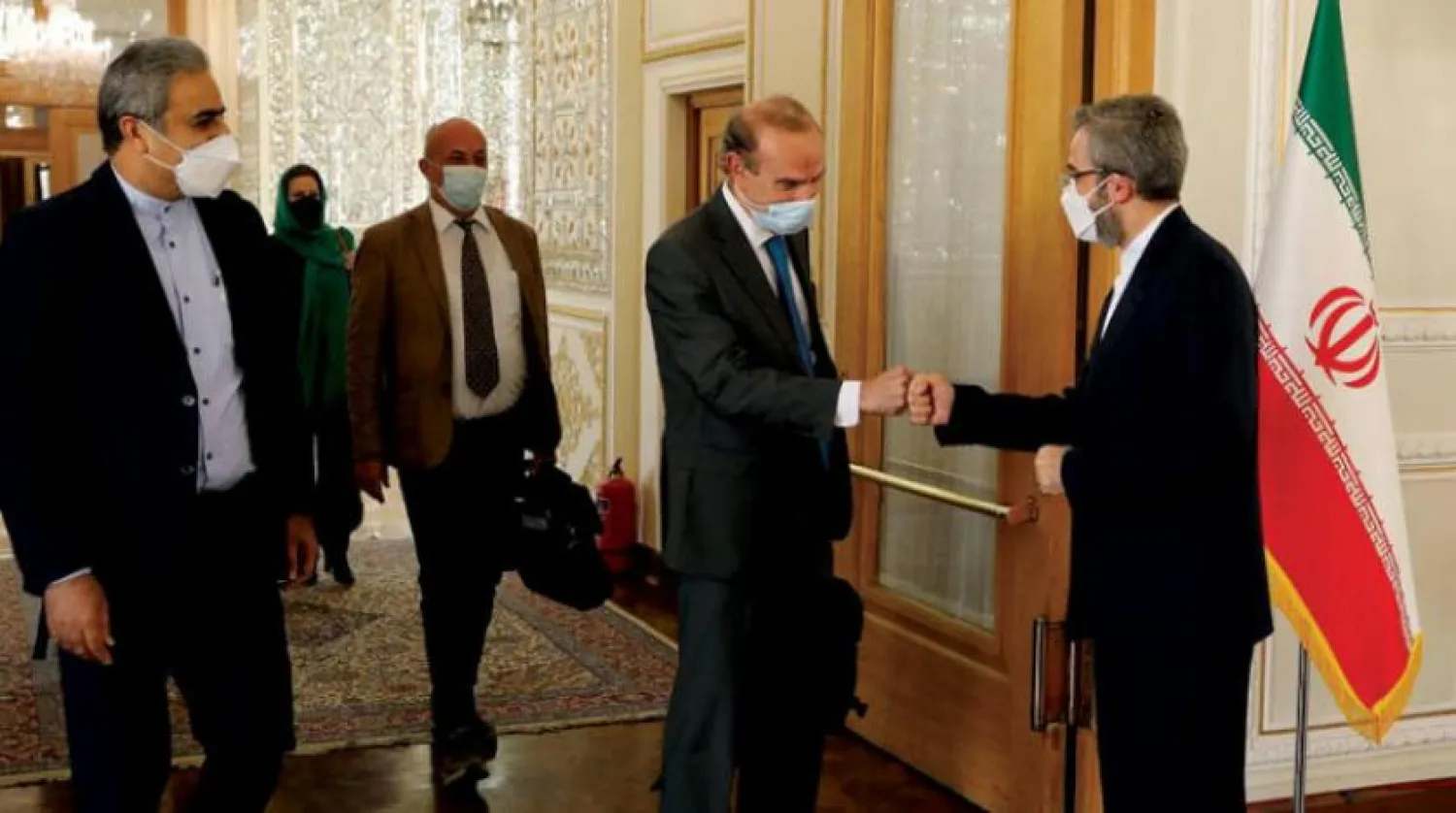 15 October 2021, Iran, Tehran: Deputy Secretary-General and Political Director of the European External Action Service and EU coordinator of nuclear talks Enrique Mora (2nd R) welcomed by Iranian Deputy Foreign Minister Ali Bagheri (R) ahead of their meeting on nuclear deal negotiations. Photo: Iranian Foreign Ministry via ZUMA Press Wire/dpa