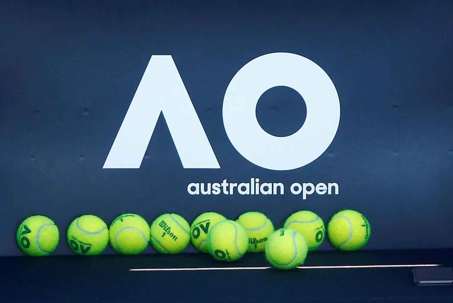 Tennis balls are pictured in front of the Australian Open logo before the tennis tournament, Melbourne, Australia, January 14, 2018. (Reuters)