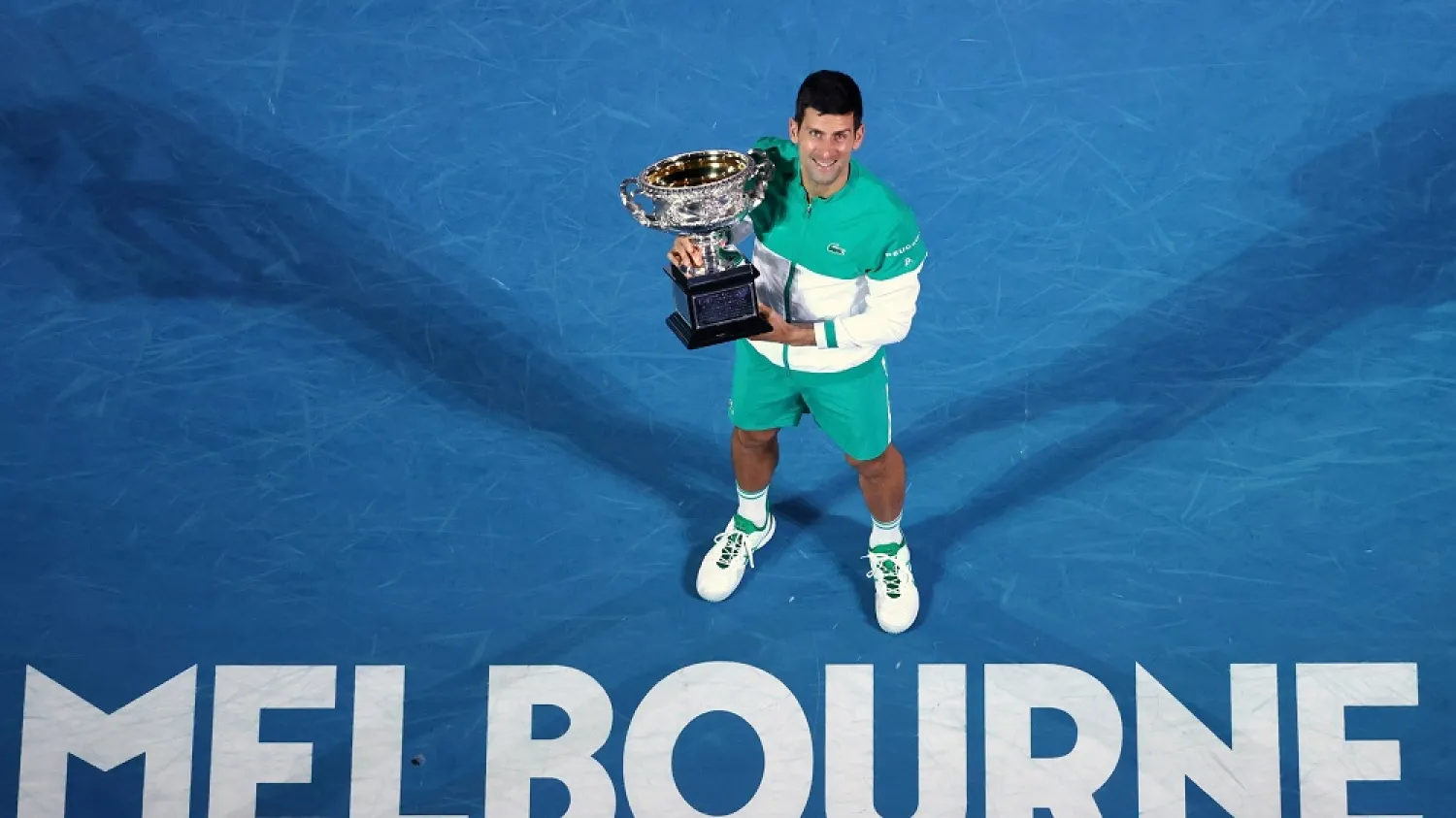 Feb. 21, 2021, file photo Novak Djokovic holds the Norman Brookes Challenge Cup after defeating Daniil Medvedev in the men’s singles final at the Australian Open tennis championship in Melbourne, Australia. (AP)