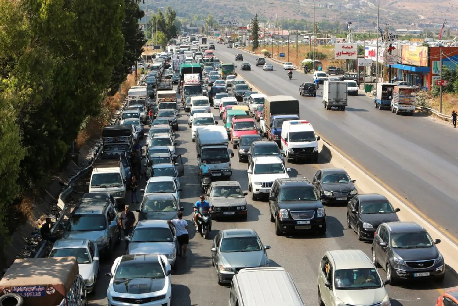 File Photo - A view shows cars stuck in a traffic jam near a gas station in Jiyeh, Lebanon, August 13, 2021. REUTERS/Aziz Taher

