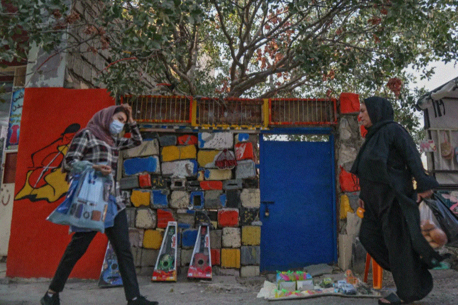 Iraqi Kurdish women walk in Halabja, part of the Kurdistan region which has cultivated an image of relative stability and tolerance SAFIN HAMED AFP
