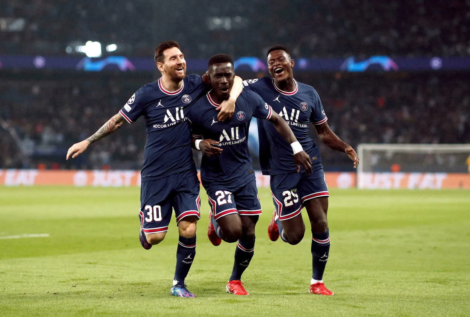 Paris St Germain's Idrissa Gueye celebrates scoring their first goal with Lionel Messi and Nuno Mendes. REUTERS/Benoit Tessier
