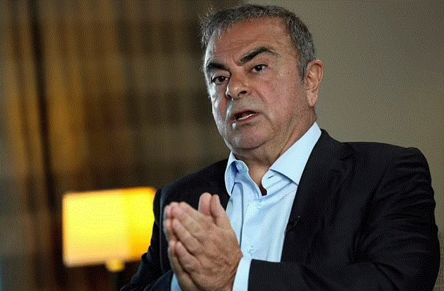 FILE - In this May 25, 2021, file photo, Nissan's former chairman Carlos Ghosn speaks during an interview with The Associated Press, in Dbayeh, north of Beirut, Lebanon.(AP Photo/Hussein Malla, File)

