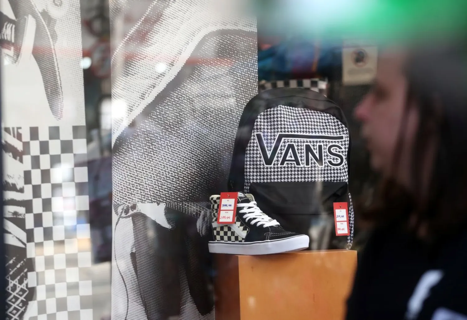 Shoes and backpack of Vans are seen in a shop window in Sao Paulo, Brazil August 29, 2019. (Reuters)