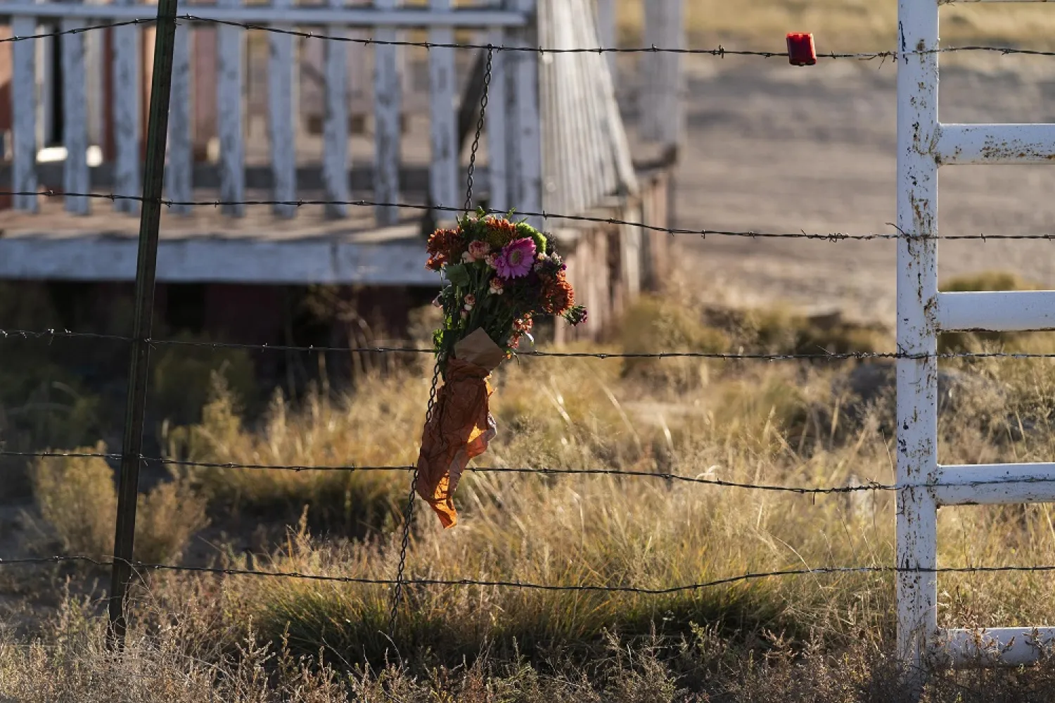 A bouquet of flowers is left to honor cinematographer Halyna Hutchins outside the Bonanza Creek Ranch in Santa Fe, N.M., Sunday, Oct. 24, 2021. (AP)
