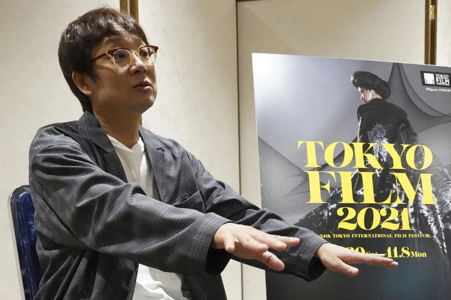 Keisuke Yoshida, a Japanese film director and screenwriter, speaks during an exclusive interview with The Associated Press Tuesday, Oct. 5, 2021, in Tokyo. (AP)