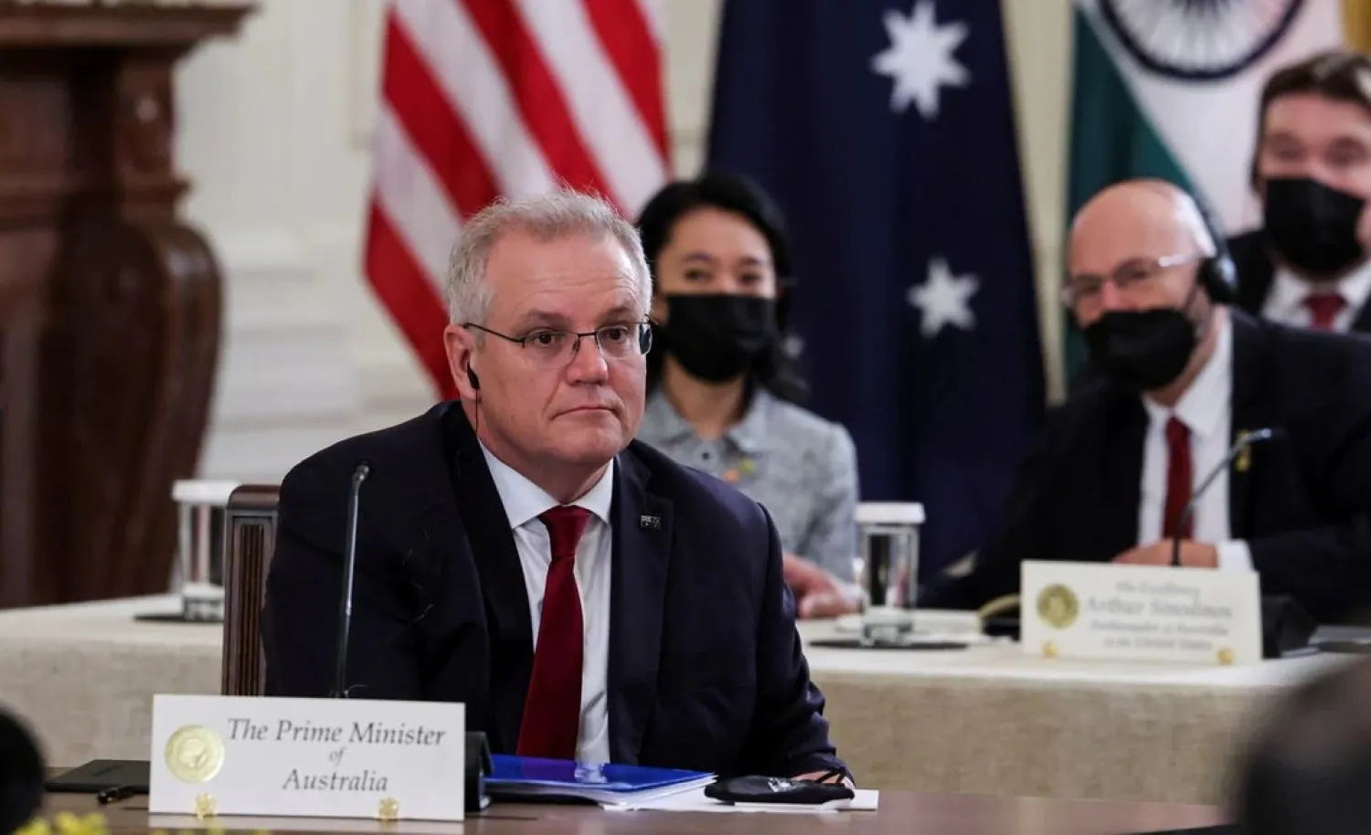 Australia’s Prime Minister Scott Morrison is seated with members of his delegation as he participates in a “Quad nations” meeting at the Leaders’ Summit of the Quadrilateral Framework hosted by US President Joe Biden in the East Room at the White House in Washington, US, September 24, 2021. (Reuters)