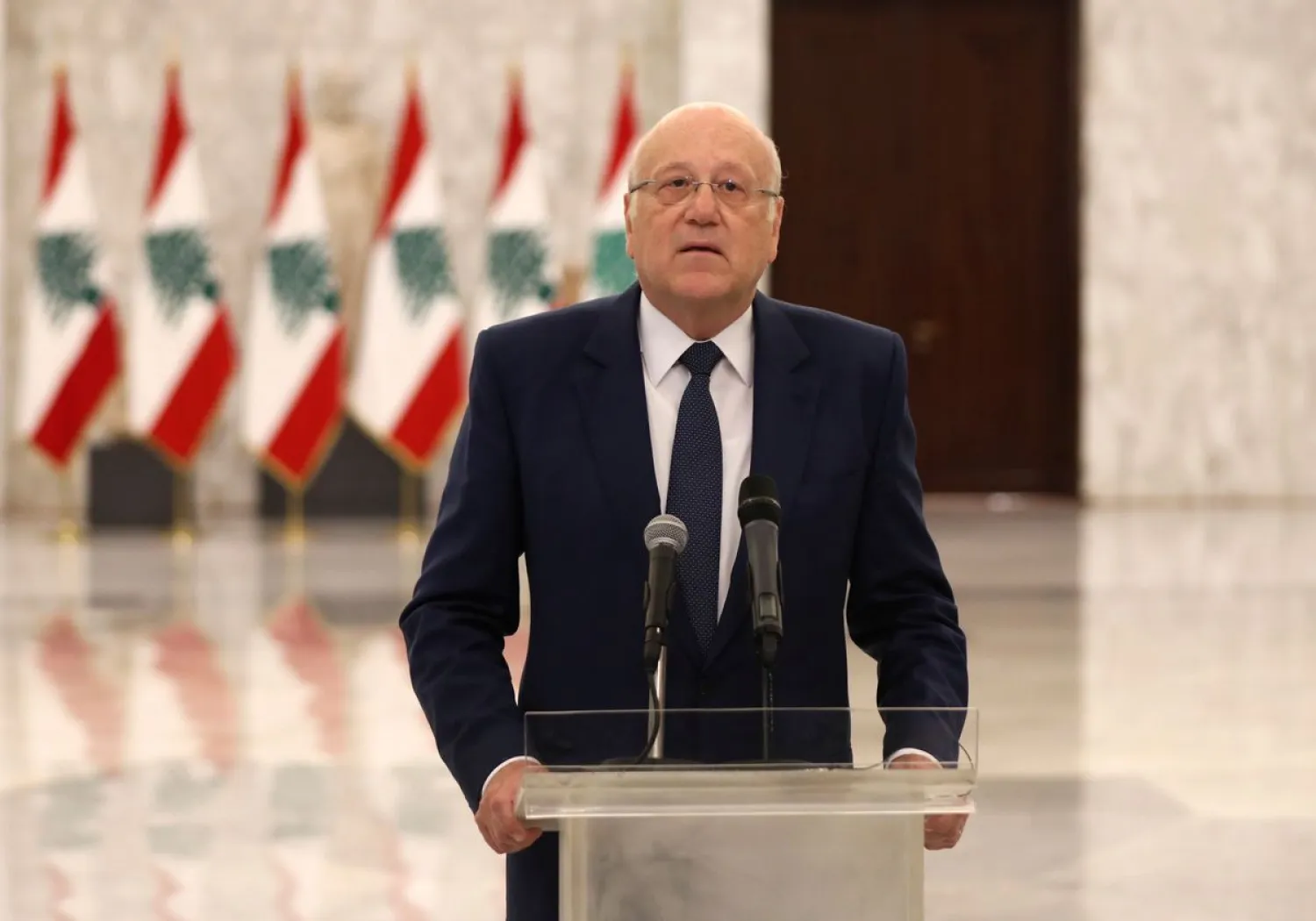 Prime Minister Najib Mikati talks at the presidential palace in Baabda, Lebanon July 26, 2021. REUTERS/Mohamed Azakir