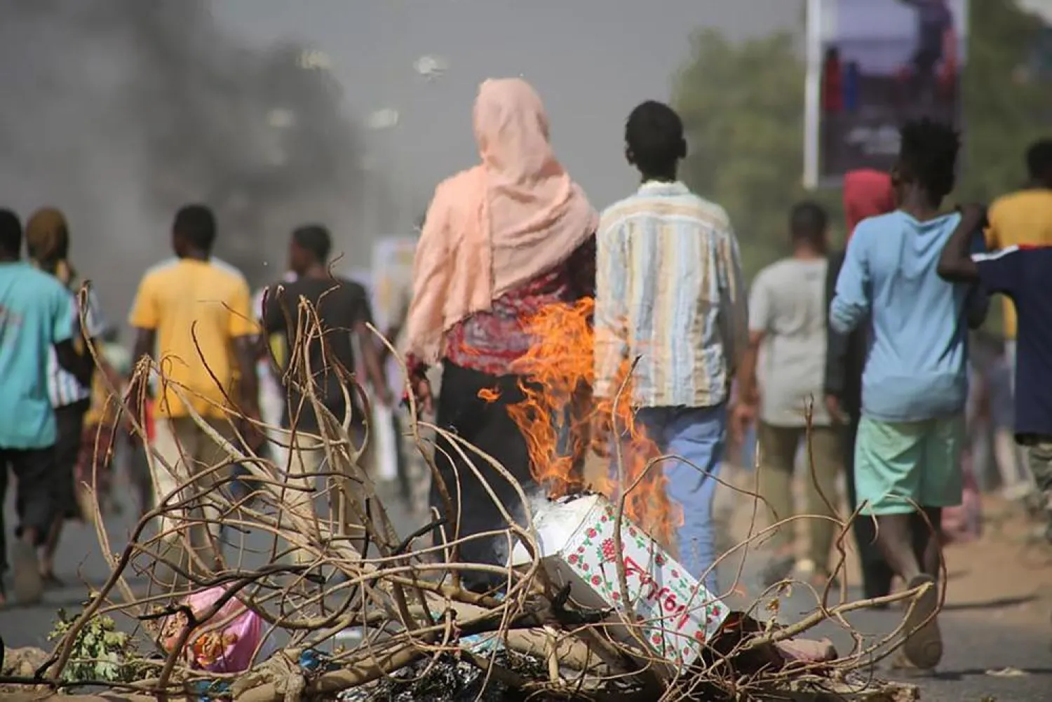 Pro-democracy protesters use fires to block streets to condemn a takeover by military officials in Khartoum, Sudan, Monday Oct. 25, 2021. (AP)