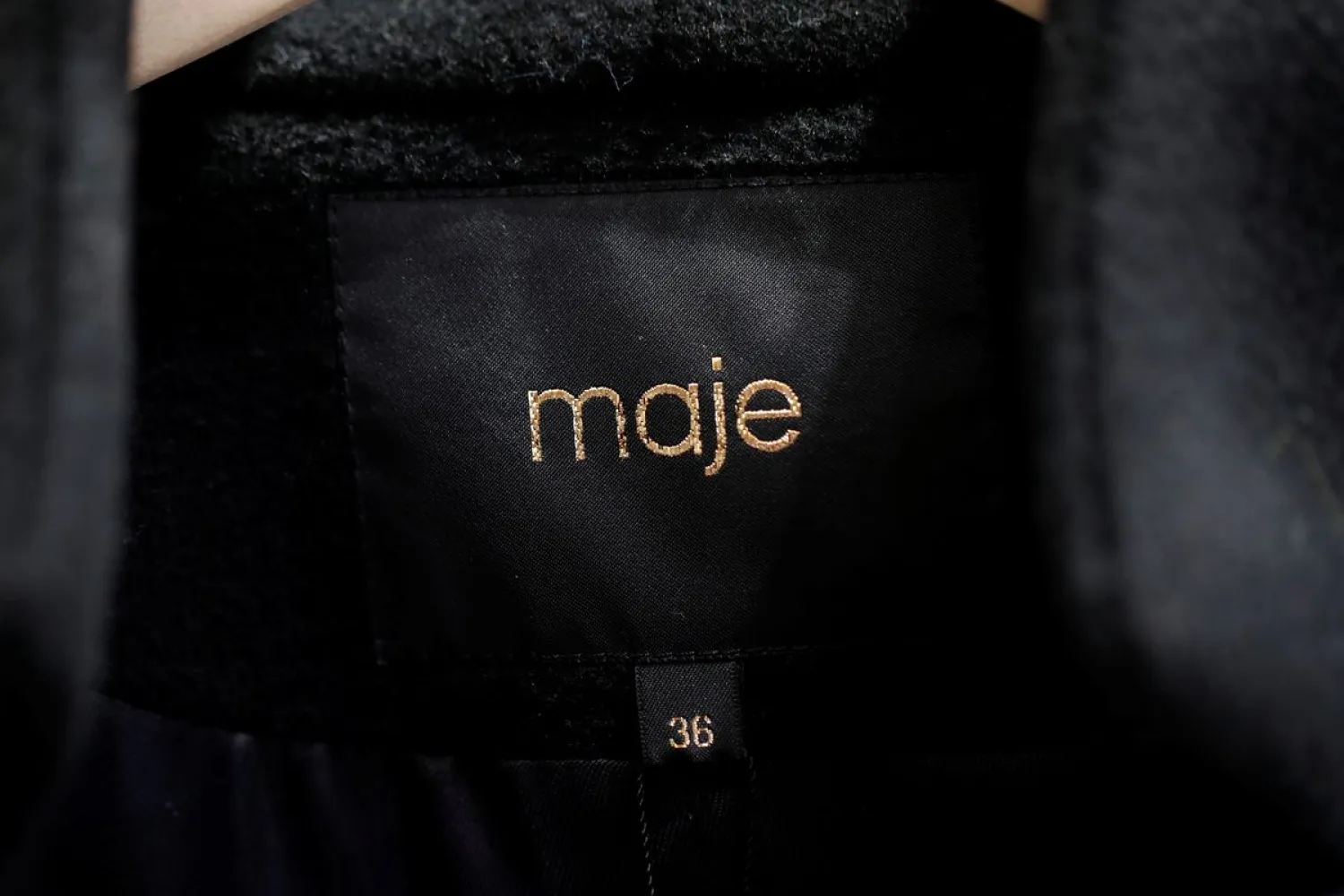 A Maje label is pictured on clothes inside a Maje luxury clothing store, operated by SMCP Group, in Paris, France, December 21, 2017. REUTERS/Benoit Tessier