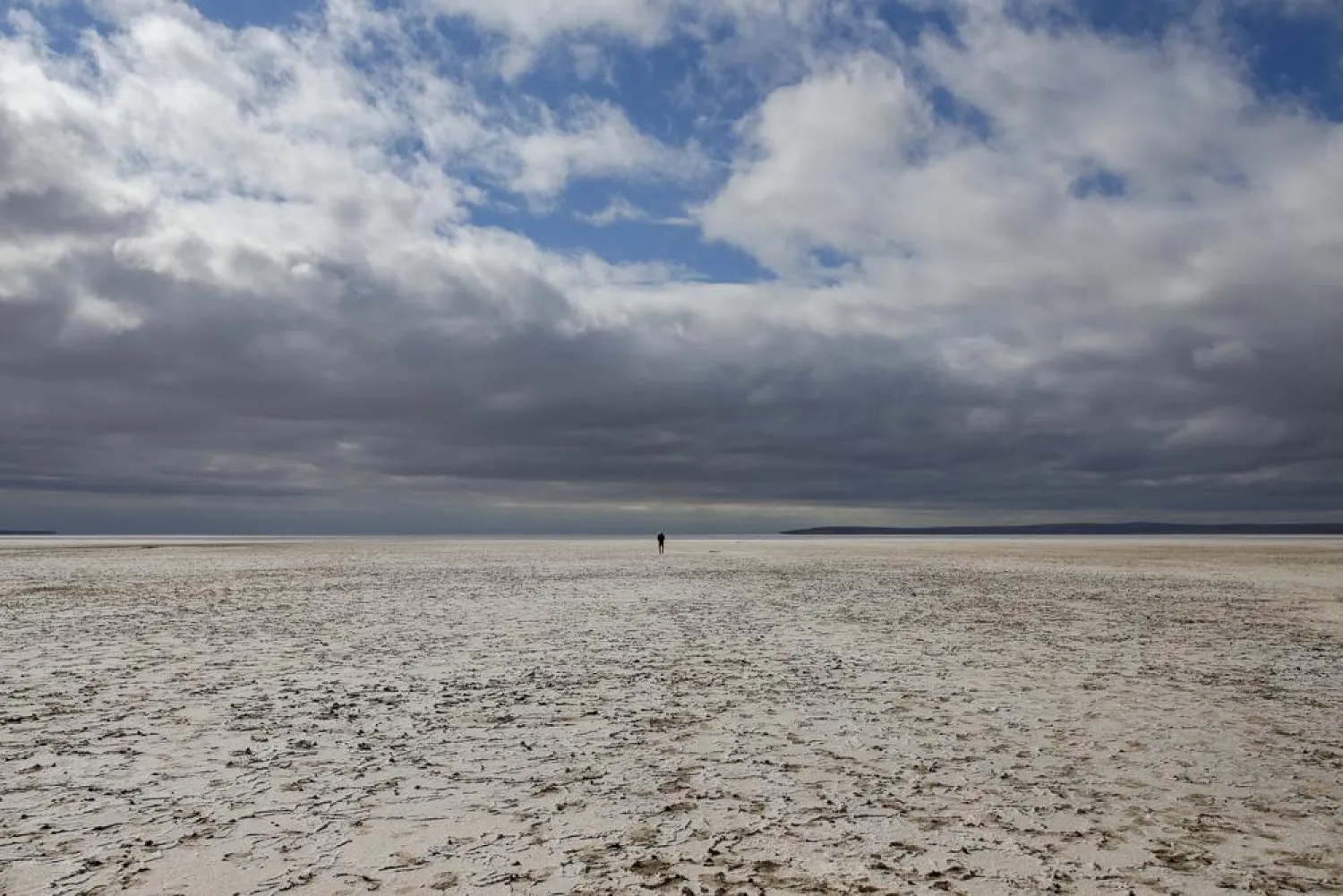 A man walks along Lake Tuz in Aksaray province, Turkey, Monday, Oct. 25, 2021. Lake Tuz, Turkey’s second largest lake, and home to several bird species has seen its waters entirely recede this year, a victim of climate change-induced drought that has hit the region as well as decades-long wrongful agricultural policies that have exhausted the lake’s underground waters. (AP Photo/Emrah Gurel)
