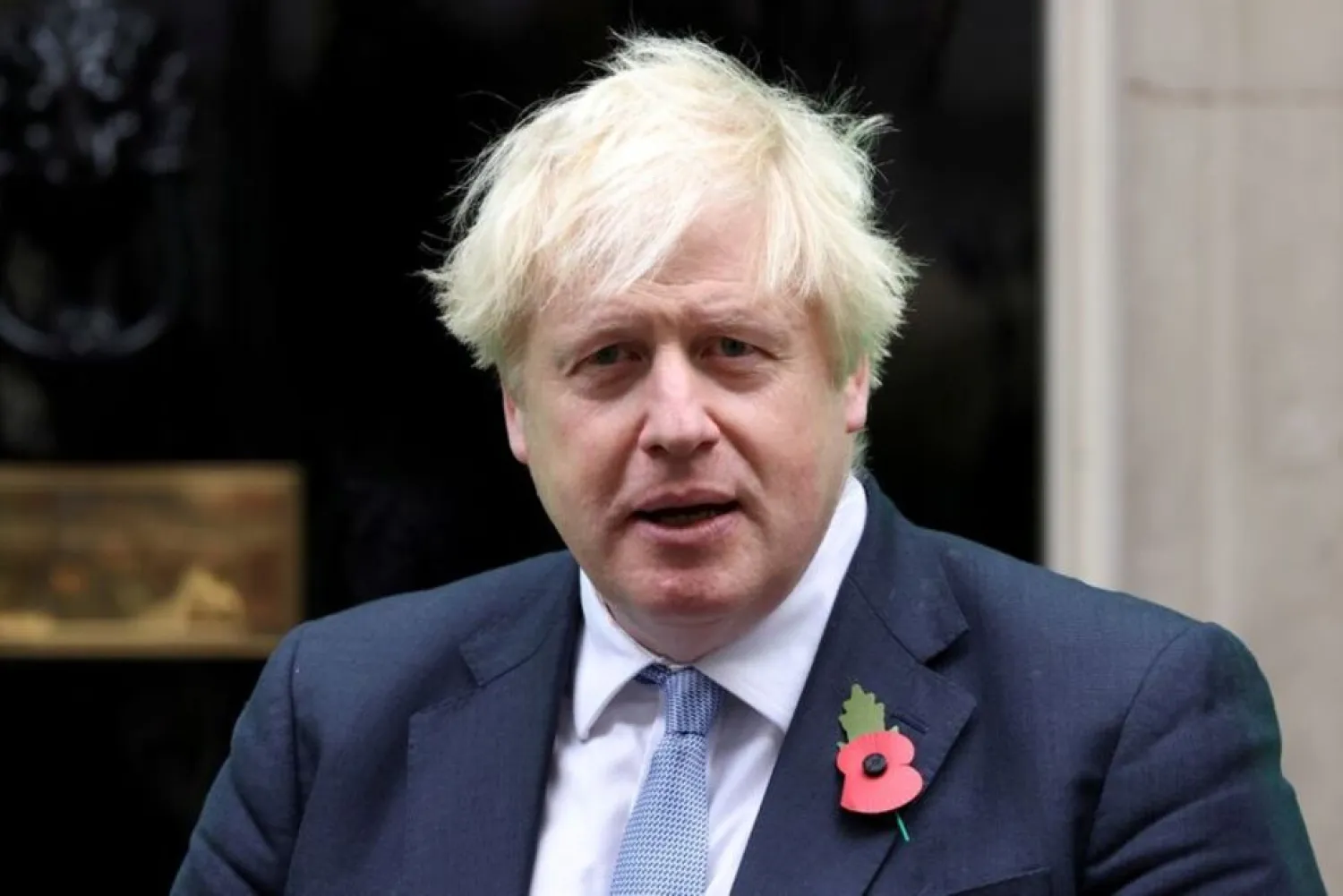 British Prime Minister Boris Johnson meets with fundraisers from the Royal British Legion outside Number 10 Downing Street in London, Britain October 29, 2021. (Reuters)