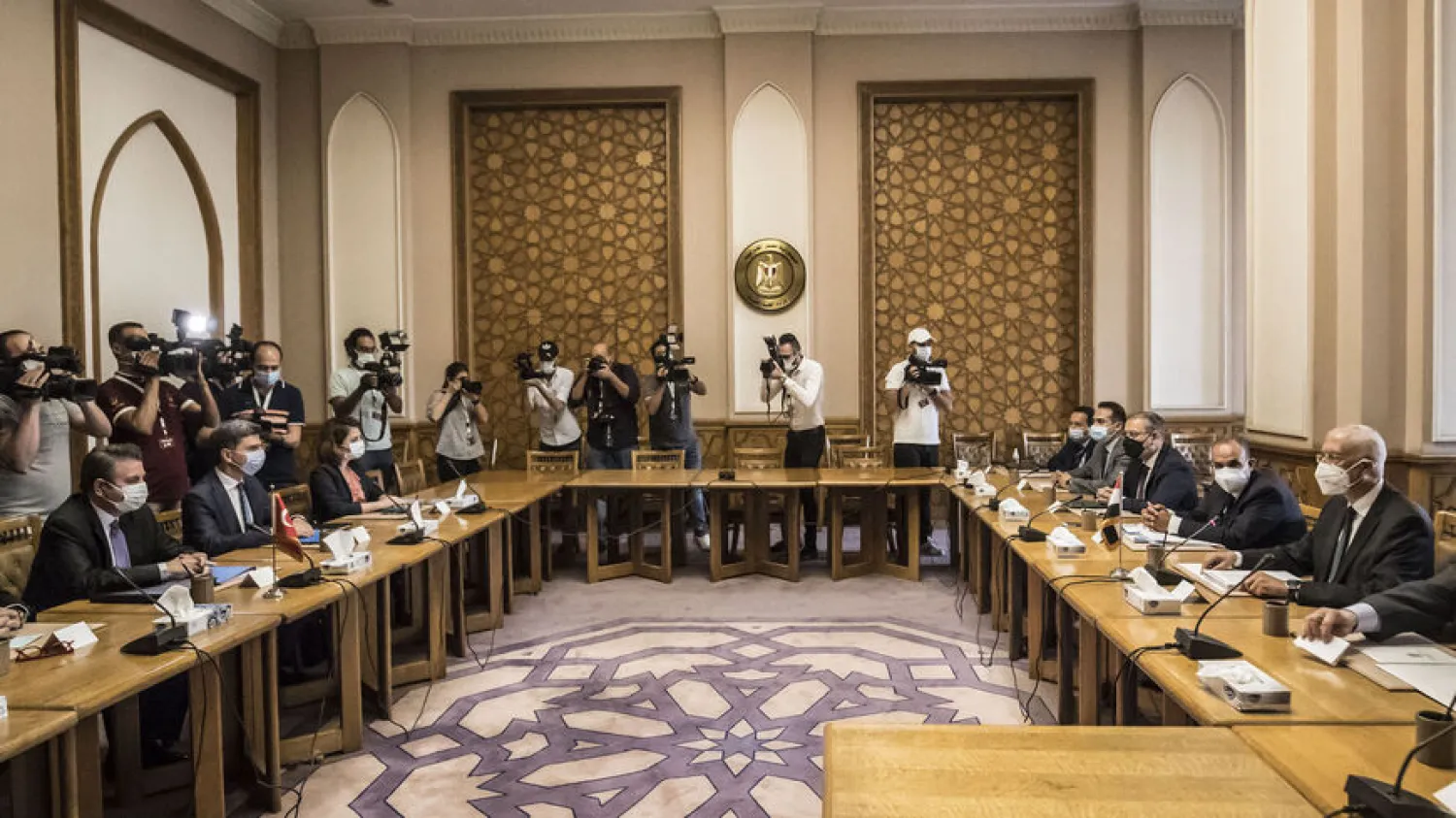 Egypt's Deputy Foreign Minister Hamdi Sanad Loza (R) meets with his Turkish counterpart Sedat Onal (L) at the Foreign Ministry in the Egyptian capital Cairo on May 5, 2021. (Getty Images)
