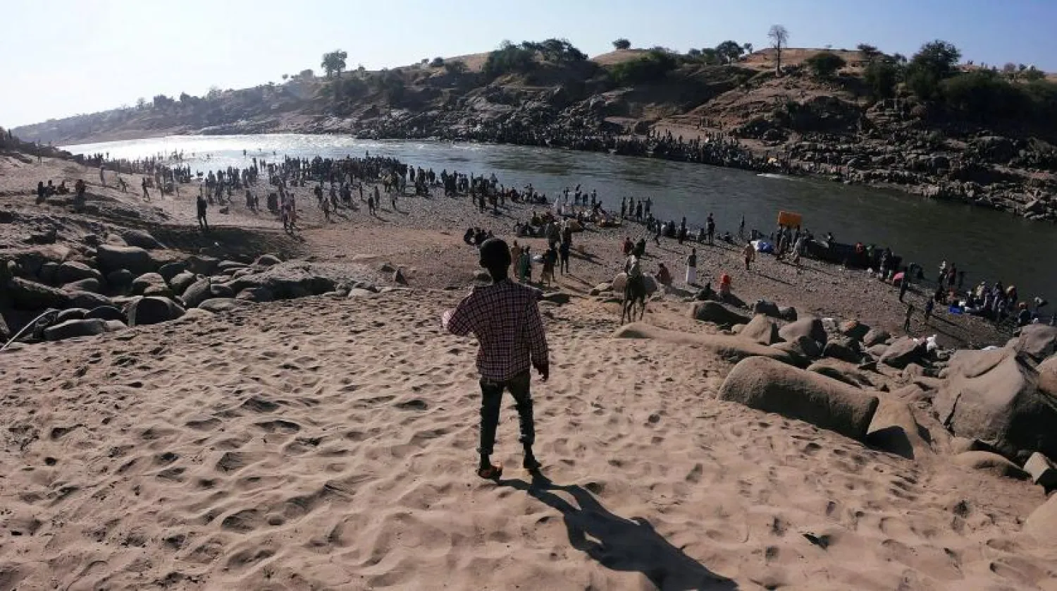 Ethiopians who fled the fighting in Tigray cross the Tekeze River into neighboring Sudan (Reuters)
