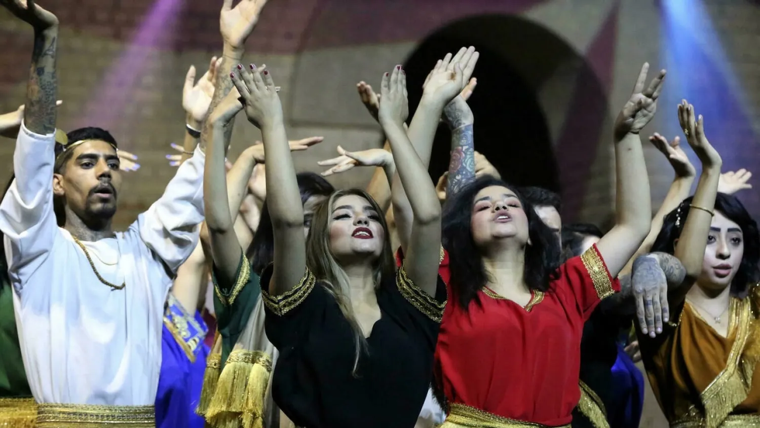 Artists perform during the launch ceremony of Babylon International Festival, at the archaeological site of ancient Babylon, on October 28, 2021. (AFP)