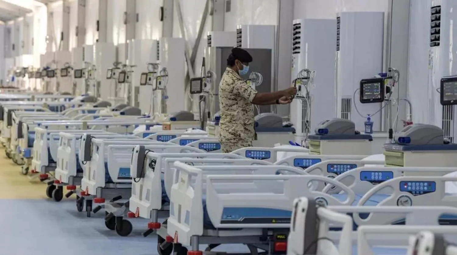 A member of the Bahraini security forces checks patient monitoring equipment at the Sitra field Intensive Care Unit (ICU) hospital for COVID-19 patients on Sitra island. (AFP)
